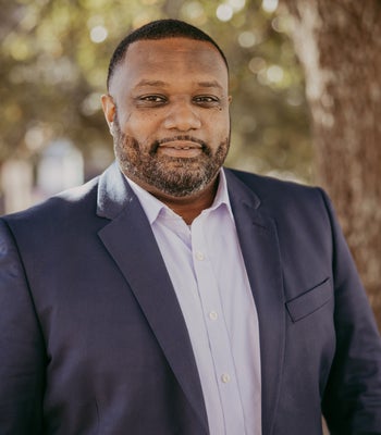 Portrait of Travis Stevenson, Sales Associate.